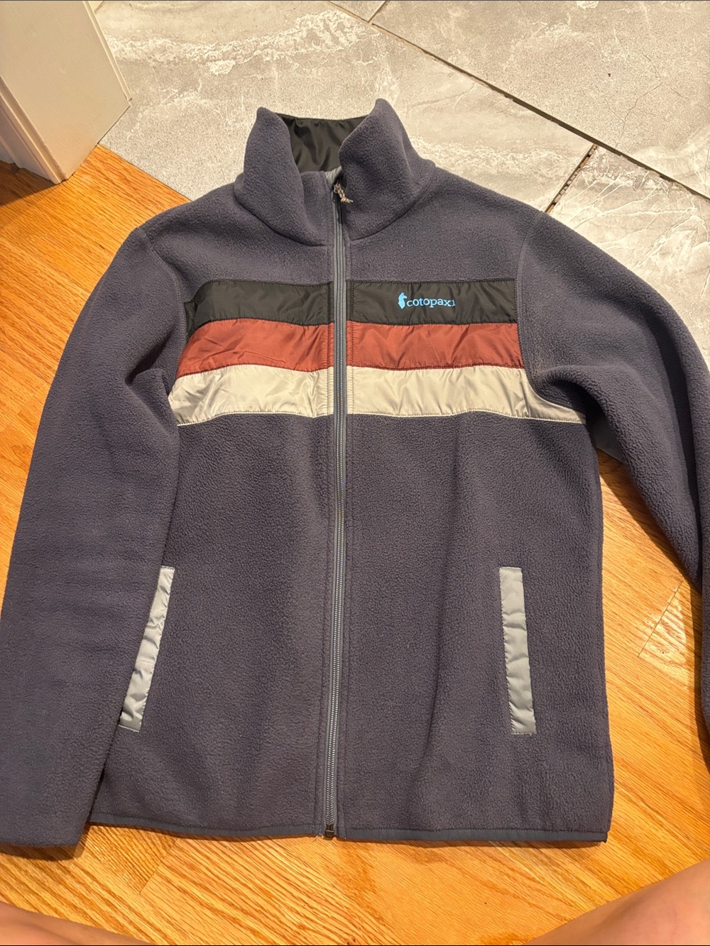 cotopaxi dark grey women’s ' Fleece Jacket with Black, Rust & Light Gray Stripes